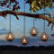 TWINKVILLA Solar Hanging Lanterns Outdoor Waterproof, Rust Iron Ball Candle Holder with Flickering Solar Powered Tea Lights, Perfect for Backyard Patio Garden Fence Tree Decoration-4Pack