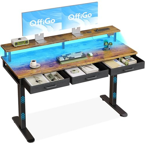 OffiGo Electric Standing Desk, 140 x 54cm Height Adjustable Desk with 3 Drawers, RGB LED Strip & Charging Station for Home Office Computer Workstation, Computer Table with Monitor Stand, Rustic Brown
