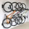 monTEK Lot de 4 supports muraux pivotants pour vélo pour garage, porte-vélos mural, économiseur d'espace, support vertical pour vélo pouvant supporter jusqu'à 30 kg, noir