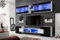 Komodee, Wohnwand Wohnzimmerset RTV Foggia, Front in Schwarz Hochglanz/Karkasse in Weiß Matt, Breite 230cm x Höhe 195cm x Tiefe 35cm, LED RGB, für Wohnzimmer, Schlafzimmer