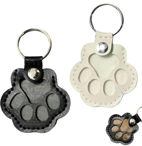 KLINNA 2pcs Schlüsselanhänger für Tierhaare, Leder Anhänger zur Tierhaar-Aufbewahrung als Haustier-Memory Erinnerungsbox, Hundehaar-Sammler in Pfote Design mit Druckknopf (Weiß+Schwarz)
