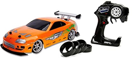 Jada Toys 253209003 Toys Fast & Furious RC-Auto, Drift 1995 Toyota Supra, Turbo, Driftfunktion,Allradantrieb,Ferngesteuertes Auto,2-Kanal Funkfernbedienung,USB Ladefunktion,1:10, orange