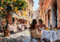 STYLER Leinwandbild Meeting 70 x 100 cm I Charmantes Straßencafé mit mediterranem Flair I Wandbild Wohnzimmer Esszimmer Küche Büro I Wanddeko Italienischer Lebensstil I Made in Europe