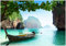 Wallario Vliestapete Fototapete Fischerboot in Thailand blaues Meer und Steinfelsen - Wandtapete Größe: 200 x 140 cm