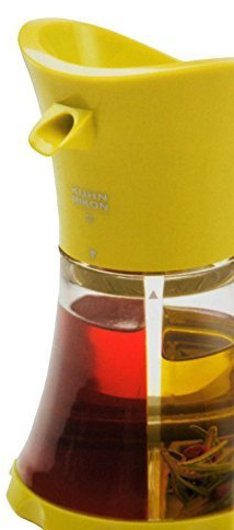 KUHN RIKON Oil/vinegar dispenser green, easy and stylish storage. Can be individually filled with two separate areas.