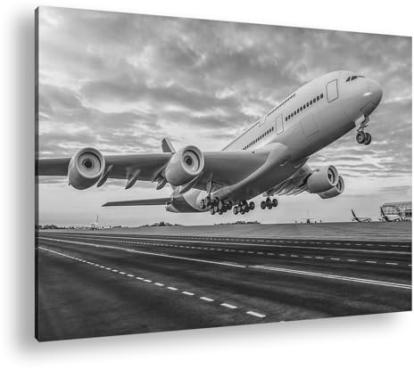 Leinwandbild Ein Flugzeug verschwindet im farbenprächtigen Sonnenuntergang Format: 100x70 cm Effekt: Schwarz&Weiß XXL Kunstdruck Bild auf Keilrahmen/Wandbild/Wohnzimmer Deko