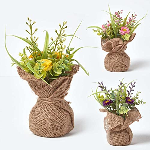 HOMESCAPES Set of 3 Artificial Daisy Plants Pink Purple & Yellow Faux Flowers in Burlap Sack 20 cm Tall Indoor Decoration