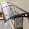 Vordach für die Haustür, mit transparenter Polycarbonatplatte und großer Dachrinne, ausziehbar und leise, ideal für Dach, Terrasse, Fenster, Veranda, Schwarz, 120 x 190 cm