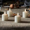Lights4fun TruGlow® 4er Kerzen Set LED Teelichter mit Timer 5,5 cm Teelichter batteriebetrieben Ostern mit Timerfunktion Echtwachs flackernde Flamme Klein