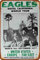 1977 Eagles Hotel California World Tour Cartel de letrero de metal, placa retro, arte, aspecto vintage, decoración de pared, bar, pub, café, hombre, cueva, 8 × 12 pulgadas