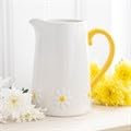 Ceramic Water Pitcher with Yellow Handle and Daisy Pattern, White