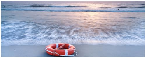 Wallario Küchenrückwand selbstklebend 115 x 50 cm, Motiv: Rettungsring am Strand bei Sonnenuntergang | Spritzschutz abwischbar & pflegeleicht