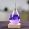 DELIBEST Sturmglas-Wettervorhersage, kreative stilvolle Wetterstation, Vorhersage, Sturm-Glasflaschen, Barometer, Desktop-Dekoration, Handwerk (lila kleiner Wassertropfen + Sockel)