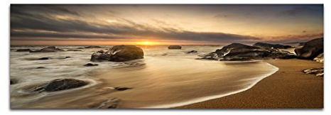 Panoramabild auf Leinwand und Keilrahmen 150x50cm Meer Strand Steine Sonnenaufgang Wolken