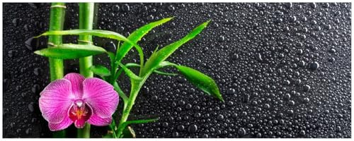 Wallario Küchenrückwand selbstklebend 115 x 50 cm, Motiv: Bambus und Pinke Orchidee auf schwarzem Glas mit Regentropfen | Spritzschutz abwischbar & pflegeleicht