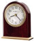 Howard Miller Monroe Tischuhr 645-446 - Moderne Wohnkultur, bogenförmige Uhr, hochglänzendes Palisanderholz-Finish mit messingfarbenem Metallfuß, Quarzwerk