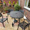 Lazy Susan 150 cm ovaler June Gartentisch in Antik Bronze mit 4 Kate Stühlen mit grünen Sitzkissen | Nachhaltiges Sandguss-Aluminium | Wetterfest | Rostfrei | Wartungsarm | 3 Jahre Garantie