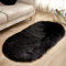 YUGWNN Schwarz Flokati Teppich Waschbar Bettvorleger Fell,Kunstfell Stuhlauflage Dekofell,Oval 60x120cm/23.6x47.2in