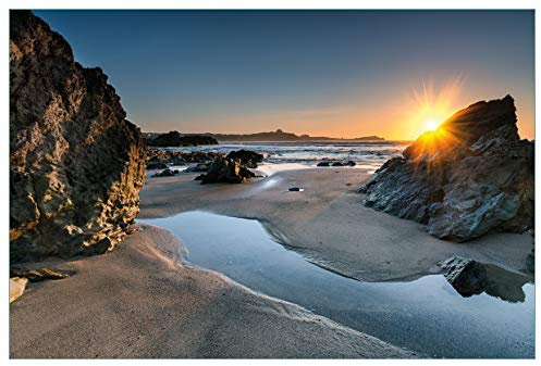 Wallario Küchenrückwand selbstklebend 90 x 60 cm, Motiv: Sonnenuntergang hinter einem Felsen am Strand | Spritzschutz abwischbar & pflegeleicht