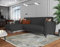 Dmora - Schlafsofa mit Halbinsel Angel, Wende-Ecksofa, Modernes Sofa mit Stauraum, Chaiselongue und 3 Kissen, 230 x 153 x 85 cm, Anthrazit