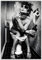 Wallario Wandbild - Kloparty - Sexy Frau auf Toilette mit Zigarette und Schnaps in Premiumqualität, Poster mit weißem Rahmen, Größe: 70 x 100 cm