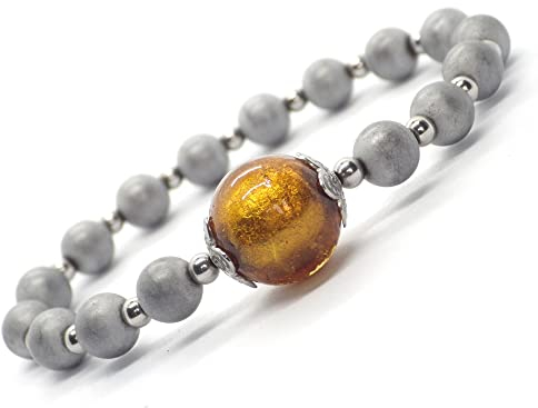 Pulsera de hematites, acero inoxidable y cuentas de cristal de Murano color oro.