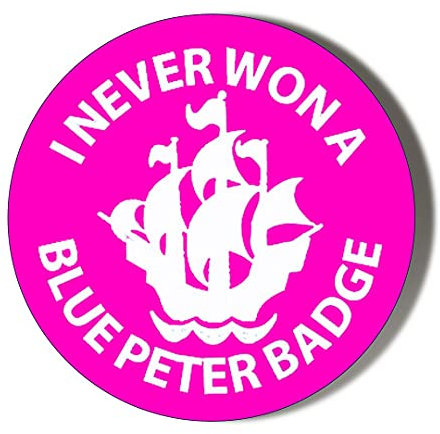 I NEVER WON A BLUE PETER BADGE PINK 38mm Small Novelty Badge