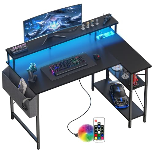 BEXEVUE 120 * 70cm L Shaped Gaming Desk with Power Outlets & LED Lights, Computer Corner Desk with Shelves Computer Workstation Table with Storage Bag for Home Office, Carbon Black